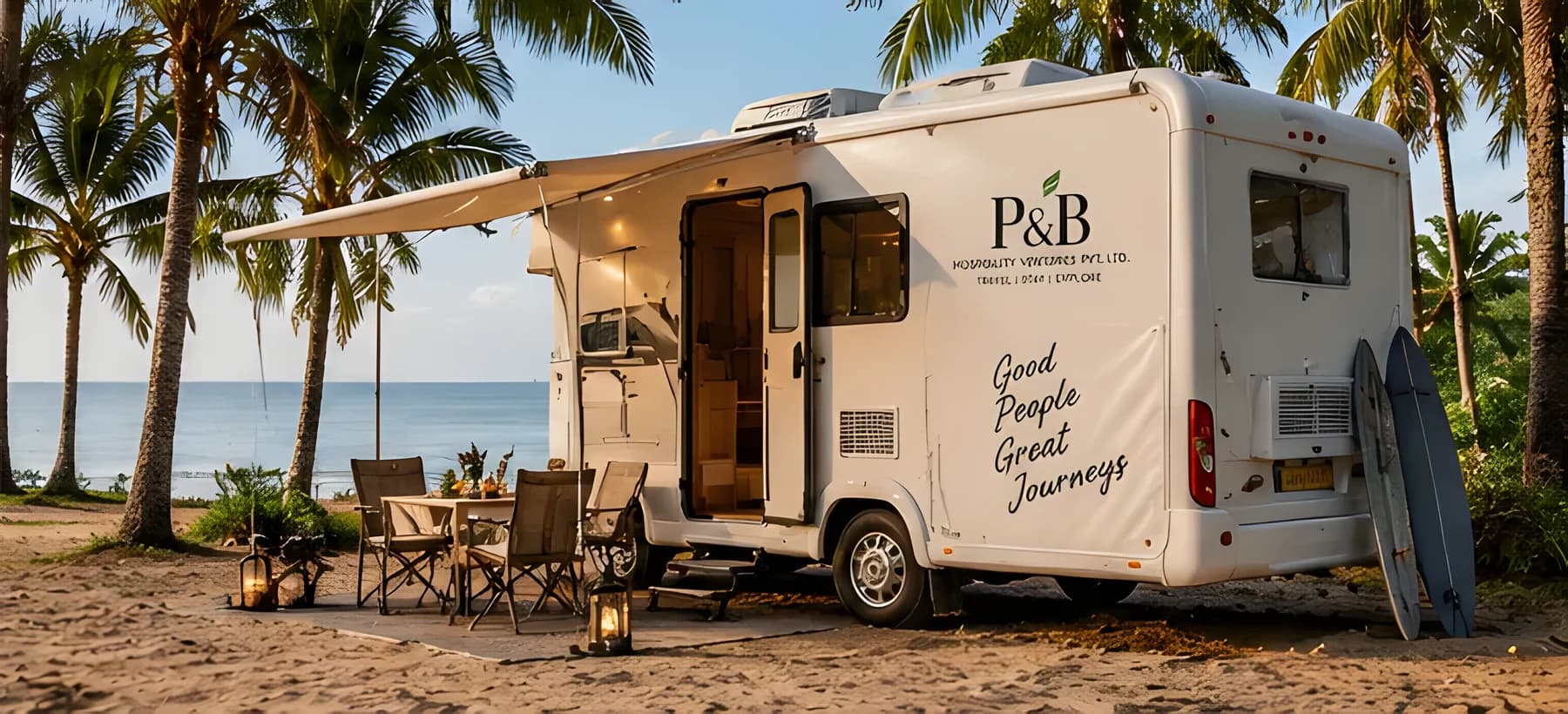 Caravan with awning and seating among palms on a beach