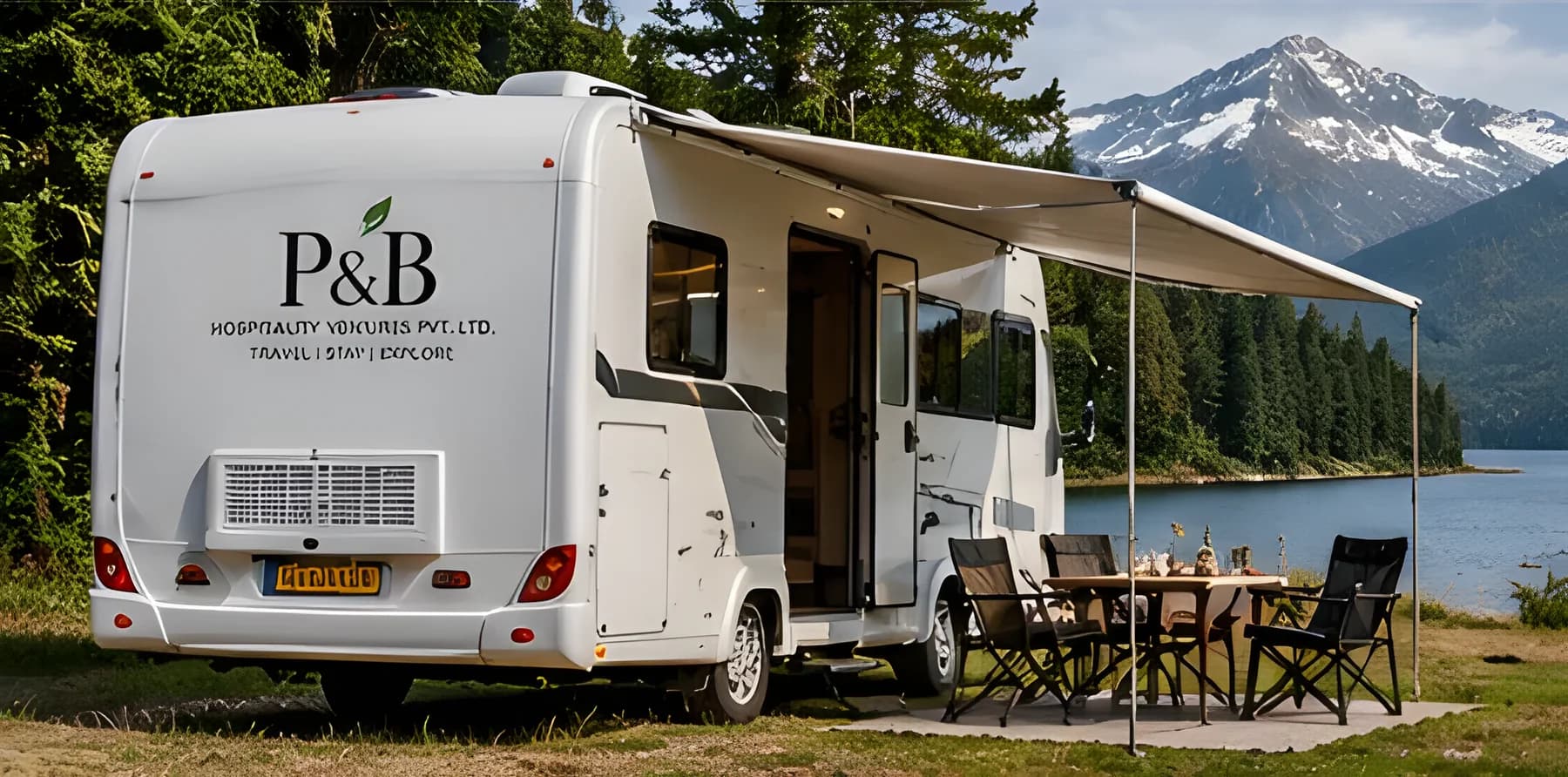 Caravan with outdoor dining set beside a mountain lake